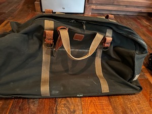 Rolling Dakota Canvas and Leather Duffle Bag. Measuring 29 x 14