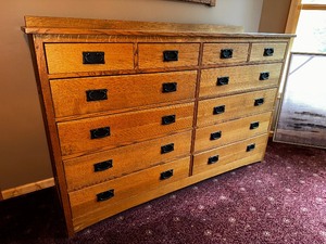 Mission Style 12 Drawer Dresser with Black Metal Pulls and Dove Tail Details. Measuring 66 inches 19 inches 44 inches.