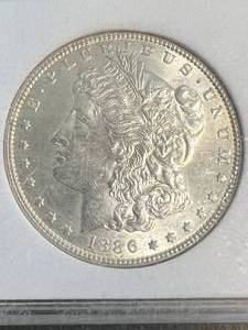 1886 US MORGAN SILVER DOLLAR SLABBED