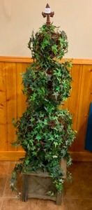 lot 103 image: Silk Topiary with Metal Fleur de Lis