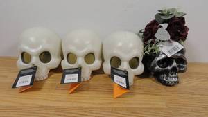 lot 149 image: Lot of 4 Plastic Skulls-3 Color Changing Light Up- 1 Floral