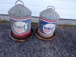 lot 40 image: Pair of Vintage Archer Rooster Feeds bird waterer