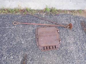 lot 48 image: Vintage Barrel Stove Door with Hook and Auger