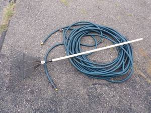 lot 95 image: Water Hose and Rake