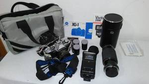 lot 310 image: Minolta XG-1, 8mm Camera, Vivitar Zoom, Sears Skylight 1A 55mm Lens.