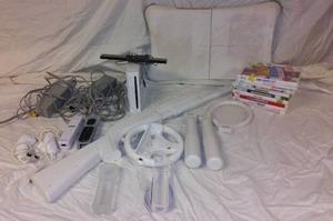 lot 942 image: WII Counsel, games, and Accessories.