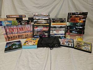 lot 859 image: DVDs and VHS.