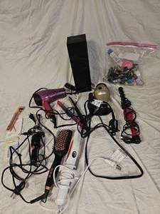 lot 864 image: Blow dryer, Curling Irons, and More.