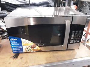 lot 59 image: Oster countertop microwave