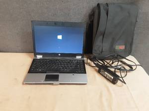 lot 114 image: hp laptop and bag