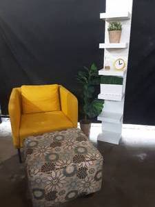 lot 126 image: yellow chair, floral ottoman, white shelf and decor