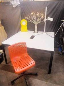 lot 138 image: large Ikea double desk, tablet stand, red rolling chair, light
