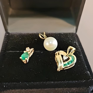 lot 12 image: 3 Emerald and Diamond Pendants Stamped 14k with 2 Grams Gold