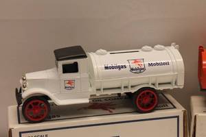 lot 48 image: Lot of 3 1931 Hawkeye Tanker Truck Coin Banks