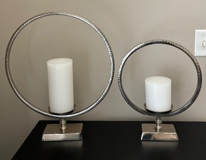 lot 27 image: Two Circular Silvery Candle Holders
