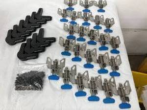 lot 59 image: MSRP $600 Lot OF 24 NEW&nbspStainless Steel Foot-Operated&nbspSwivel Lock 5213.66 Caster&nbspWheel Locks Brakes Heavy Duty & Lot Of 10 NEW&nbspBlack Round Ends Replacement PVC Corner Bumpers C60-1050