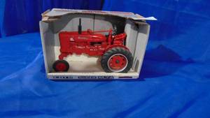 lot 12 image: New in Box Farmall Super M-TA 116 Scale Tractor by Ertl