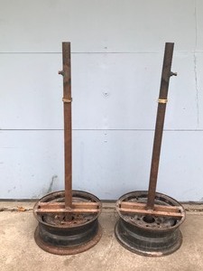 lot 156 image: 2 - Pole Stands with Tire Rims for Bases