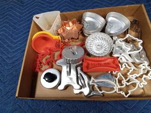 lot 89 image: Flat of vintage cookie cutters, advertised funnels and measuring cup, jello molds