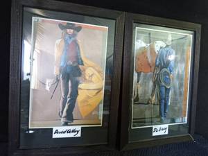 lot 61 image: A cowboy and a cowgirl print -framed