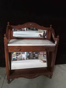 lot 2 image: Marble top stand with mirror underneath