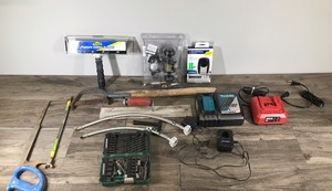 lot 579 image: Popcorn Ceiling Scraper - Mikita-Skil & Tool Shop Chargers - 2 New toilet supply lines 16 - Garage door remote new in package  - cement trowel - saws and more