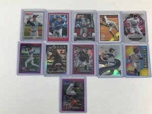 lot 599 image: Lot of 11 Baseball Cards all in Top Loaders - Carlos Correa - Aaron Judge - Derek Jeter - Juan Soto and More