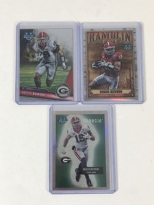 lot 653 image: Lot of 3 Brock Bowers Football Cards all in Top Loaders