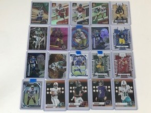lot 657 image: Lot of 20 Football Cards all in Top Loaders - Tua Tagovailoa - Russell Wilson - Tyreek Hill - Mathew Stafford and More