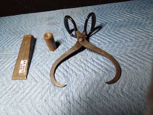 lot 634 image: Ice tongs, log splitting wedge, and more