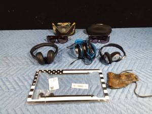 lot 549 image: 2 Pairs of Ed Hardy sunglasses, 3 headphones, leather visor, and license frame