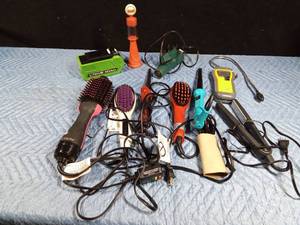 lot 602 image: Combustible gas leak detector, hot air gun, avon gas pump bottle, lithium battery charger, curling iron and straighteners (like new)