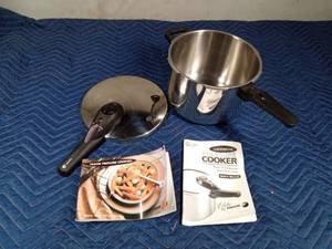 lot 521 image: Commercial pressure cooker with lid, cookbook and instructions