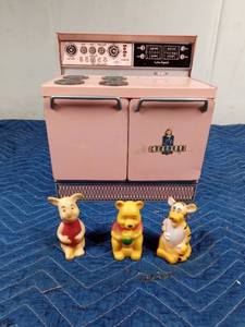 lot 509 image: Vintage childs metal stove and 3 rubber Winnie the Pooh characters