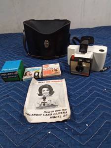 lot 502 image: Vintage Polaroid Land camera with case, film flashbulbs and instructions