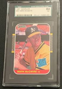 lot 142 image: Mark McGwire RC Graded SGC 84 NM 1987 Donruss Rated Rookie #46 Baseball Card