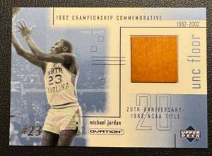 lot 5B image: Michael Jordan Game Used Court Floor Relic 2001 Upper Deck Ovation #MJFI - 1982 Championship Commemorative UNC Floor - Basketball Card