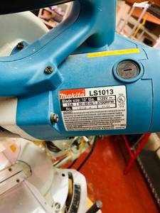 lot 9 image: MAKITA Sliding Comp Saw on RIDGID Stand