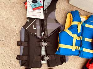 lot 58 image: 3 Sizes of Life Vests, Coolers