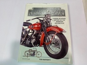 lot 4 image: Highly Collectible Harley Davidson Stein and Coffee Table Book