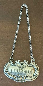 lot 89 image: Sterling Silver Bourbon and Scotch Decanter Labels