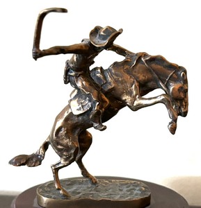 lot 93 image: Danbury Mint Bronze Bronco Buster Figurine by Frederic Remington