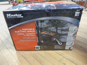 lot 33 image: Master Lock Portable Electric Winch