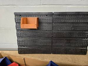 set of wall mounted small parts organizer bins and wall unit
