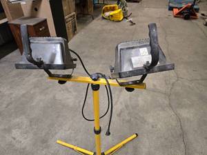 work light - stand folds up. Adjustable light heads - may need new bulbs