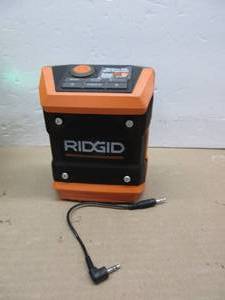 lot 24 image: Ridgid R84086B 18V Lithium Ion Cordless Mini Bluetooth Radio w Clock and USB Smart Phone Charging (Batteries and Charger NOT Included  Radio Only) A PIECE LOOSE INSIDE, USED, TESTED, WORKS