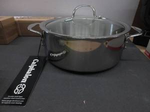 lot 63 image: Calphalon Tri-Ply Stainless Steel Cookware, Dutch Oven, 5-quart HAS SCRATCHES, LID IS A BIT WOBBLY, NEW