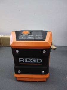 lot 64 image: Ridgid R84086B 18V Lithium Ion Cordless Mini Bluetooth Radio w Clock and USB Smart Phone Charging (Battery and Charger Not Included  Radio Only) USED, TESTED, WORKS