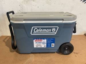 lot 131 image: Coleman 316 Series 62QT Lakeside Blue Hard Chest Wheeled Cooler