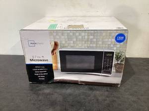 lot 703 image: Mainstays 0.7 Cu ft Countertop Microwave Oven 700 Watts